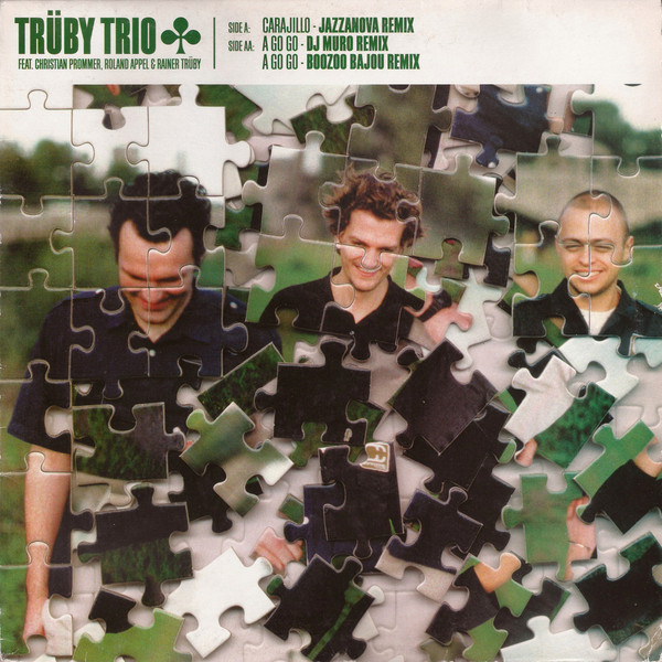Trüby Trio Feat. Christian Prommer , Roland Appel & Rainer Trüby - Carajillo / A Go Go (Remixes) | Compost Records (COMPOST 082-1)